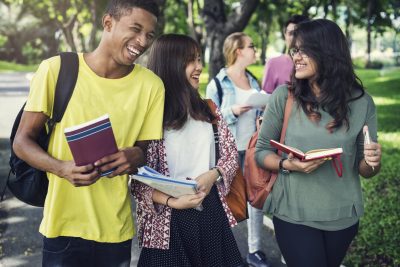 Diverse Young Students Book Outdoors Concept